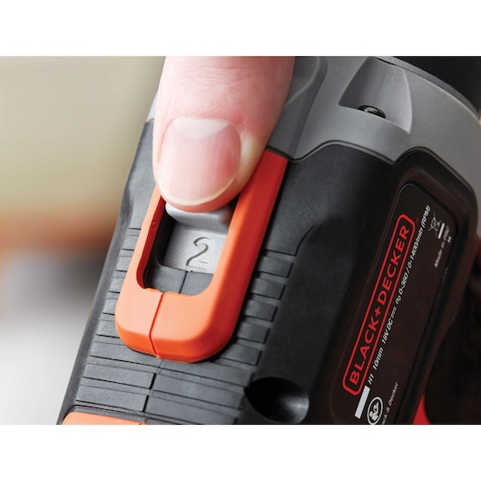 Close-up photo of BLACK+DECKER BCD703C1 drill speed selector being adjusted by a hand.