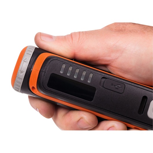 Close-up photo of BLACKDECKER BCRT8K35 black and orange handheld device with USB port and LED indicators.