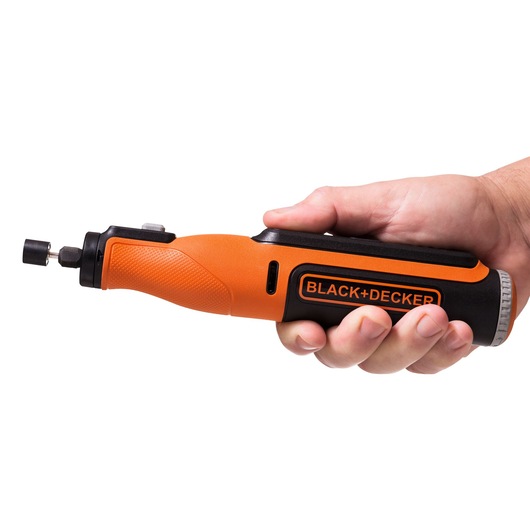Photo of BLACK+DECKER BCRT8K35 orange and black rotary tool held in a right hand, side angle.