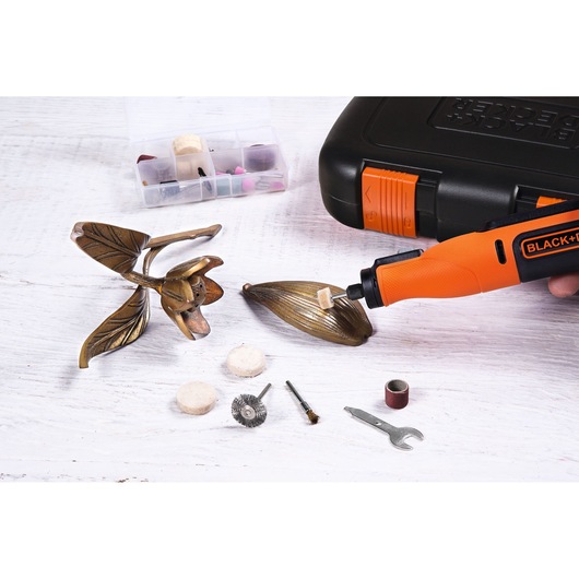 BLACK+DECKER BCRT8K35 rotary tool kit with orange handle, various accessories, and carrying case, photo from above.