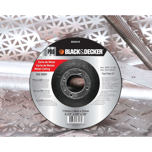 A BLACK+DECKER branded metal cutting disc, product code BDA0410, is shown placed on a metallic patterned surface. The disc is labeled with specifications for metal cutting, including size 115mm x 3mm x 22mm, operating speed limits, and ISO 9001 certification. Text is presented in English, Spanish, and Portuguese.