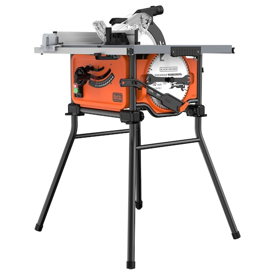 Photo of BLACK+DECKER BES71800TSS table saw with orange body, mounted on a four-leg black stand, angled view.